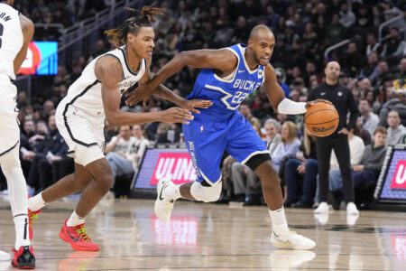 Dec 26, 2024; Milwaukee, Wisconsin, USA; Milwaukee Bucks forward Khris Middleton (22) drives towards the basket during the first quarter against the Brooklyn Nets at Fiserv Forum. Mandatory Credit: Jeff Hanisch-Imagn Images