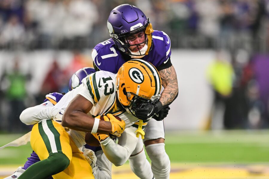 Byron Murphy Jr. (7) tackles Green Bay Packers wide receiver Dontayvion Wicks (13)