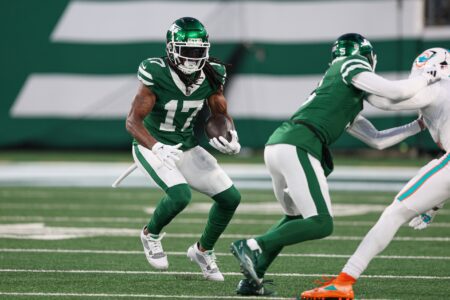 Jan 5, 2025; East Rutherford, New Jersey, USA; New York Jets wide receiver Davante Adams (17) gains yards after catch during the first quarter against the Miami Dolphins at MetLife Stadium. Mandatory Credit: Vincent Carchietta-Imagn Images