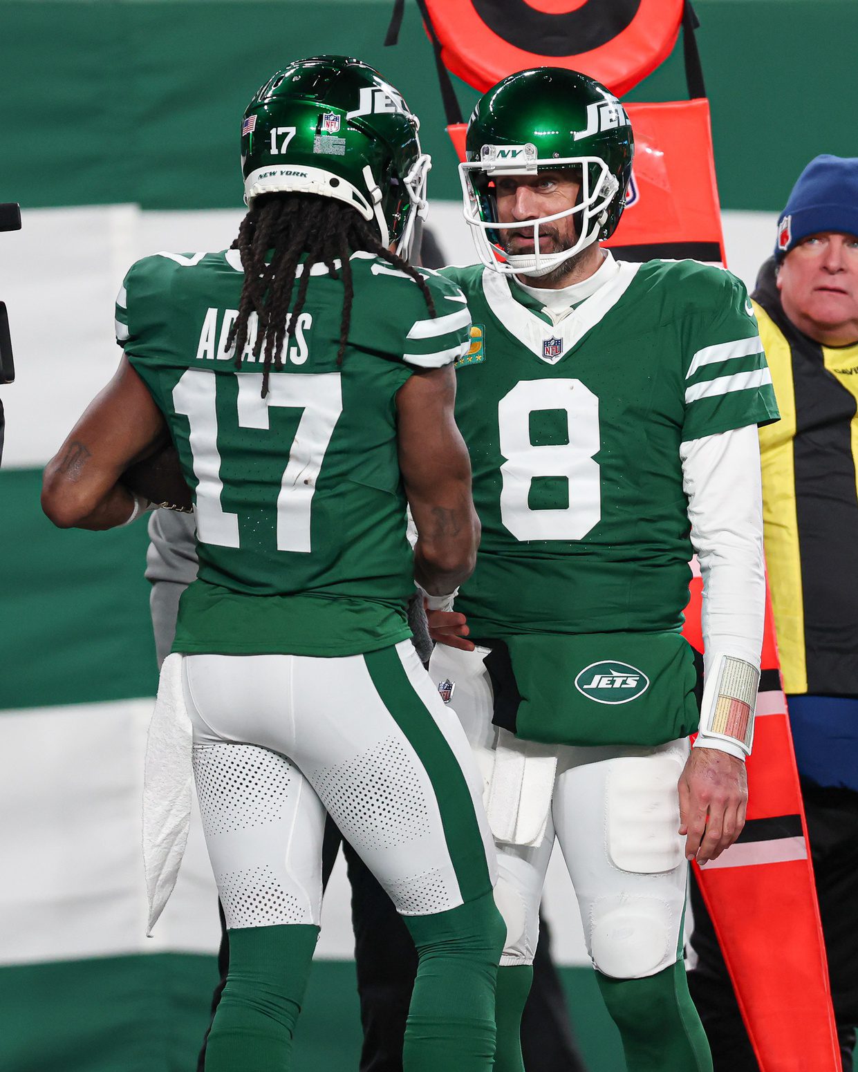 Jan 5, 2025; East Rutherford, New Jersey, USA; New York Jets quarterback Aaron Rodgers (8) and wide receiver Davante Adams (17) celebrates after a touchdown during the second half against the Miami Dolphins at MetLife Stadium. Mandatory Credit: Vincent Carchietta-Imagn Images