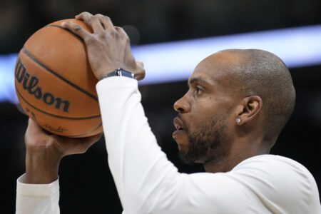 Jan 8, 2025; Milwaukee, Wisconsin, USA; Milwaukee Bucks forward Khris Middleton (22) shoots during warmups prior to the game against the San Antonio Spurs at Fiserv Forum. Mandatory Credit: Jeff Hanisch-Imagn Images