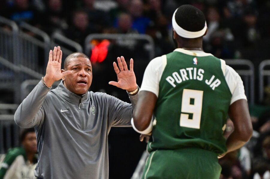 Milwaukee Bucks head coach Doc Rivers gives forward Bobby Portis (9) a high-five