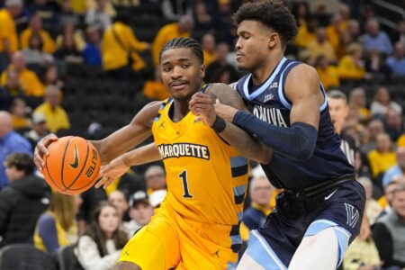 Marquette Golden Eagles guard Kam Jones (1) drives for the basket against Villanova Wildcats guard Jordan Longino