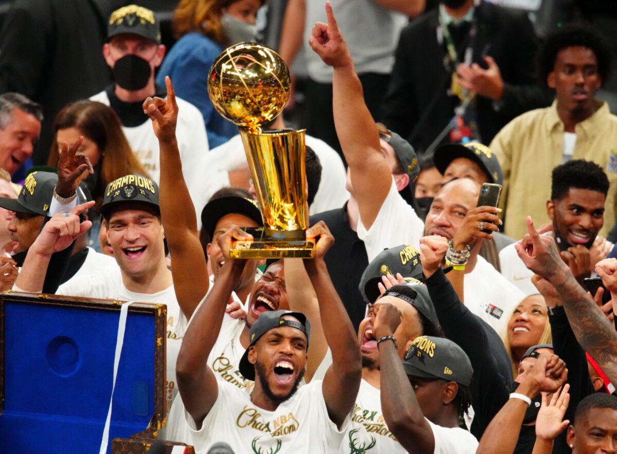 July 20, 2021; Milwaukee, Wisconsin, USA; Milwaukee Bucks striker Khris Middleton (22) celebrates the trophy of Larry O'Brien after the sixth match of the NBA 2021 finals and the championships against Phoenix Suns on the Fiserv forum. Mandatory loan: Mark J. Rebilas-Us Today Sports