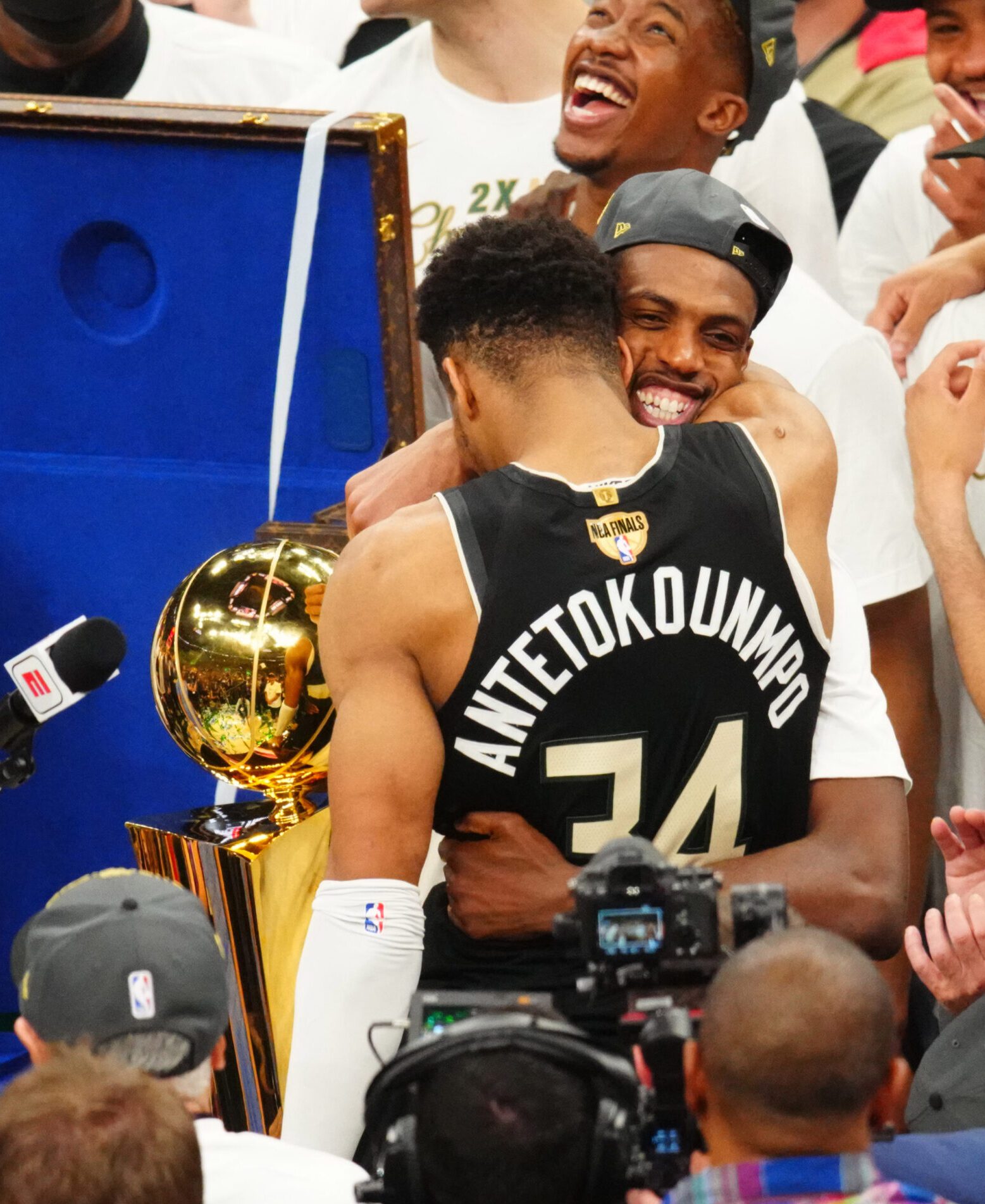 Jul 20, 2021; Milwaukee, Wisconsin, USA; Milwaukee Bucks forward Giannis Antetokounmpo (34) hugs Khris Middleton as they celebrate after defeating the Phoenix Suns during game six of the 2021 NBA Finals at Fiserv Forum. Mandatory Credit: Mark J. Rebilas-USA TODAY Sports