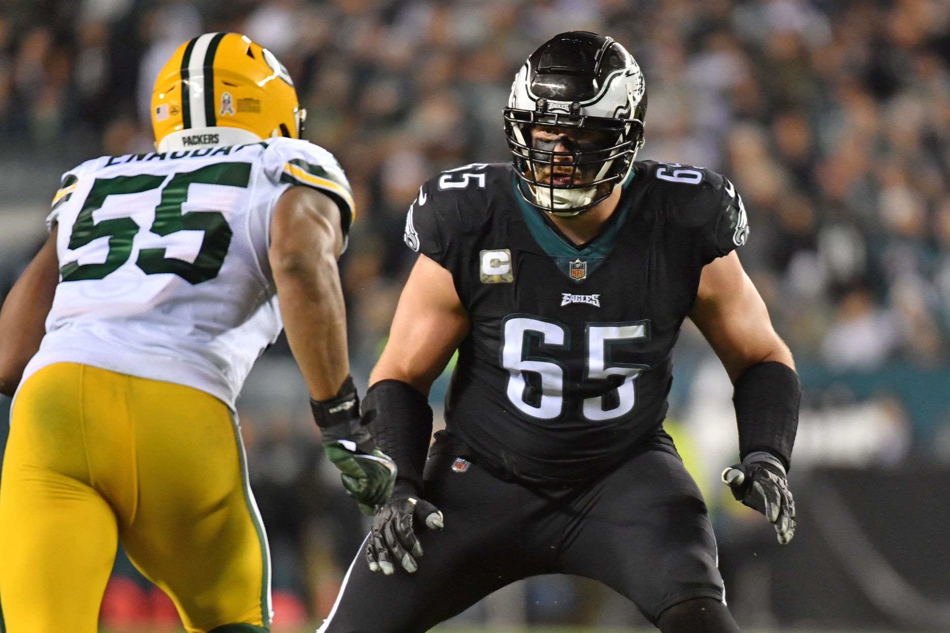 Nov 27, 2022; Philadelphia, Pennsylvania, USA; Philadelphia Eagles offensive tackle Lane Johnson (65) prepare to block Green Bay Packers linebacker Kingsley Enagbare (55) at Lincoln Financial Field. Mandatory Credit: Eric Hartline-Imagn Images