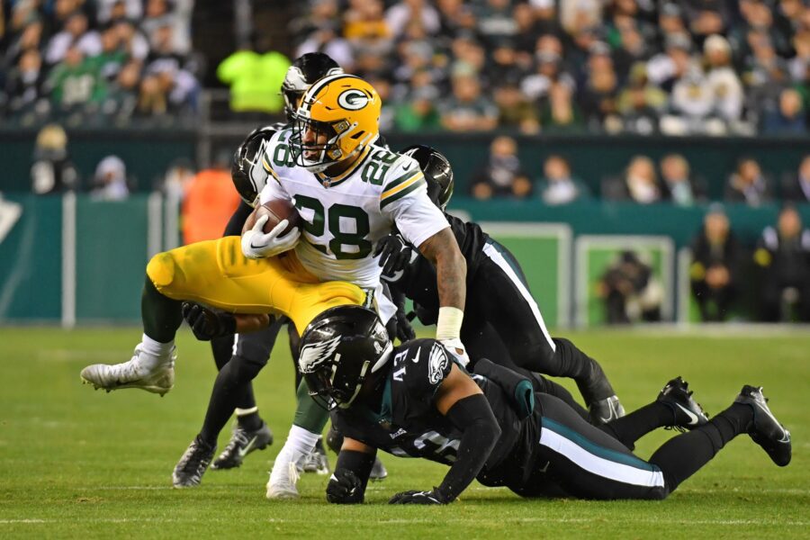 Nov 27, 2022; Philadelphia, Pennsylvania, USA; Green Bay Packers running back AJ Dillon (28) is tackled by Philadelphia Eagles linebacker Kyzir White (43) at Lincoln Financial Field. Mandatory Credit: Eric Hartline-Imagn Images