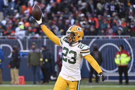 Dec 4, 2022; Chicago, Illinois, USA; Green Bay Packers cornerback Jaire Alexander (23) celebrates after making an interception against the Chicago Bears during the second half at Soldier Field. Mandatory Credit: Matt Marton-Imagn Images