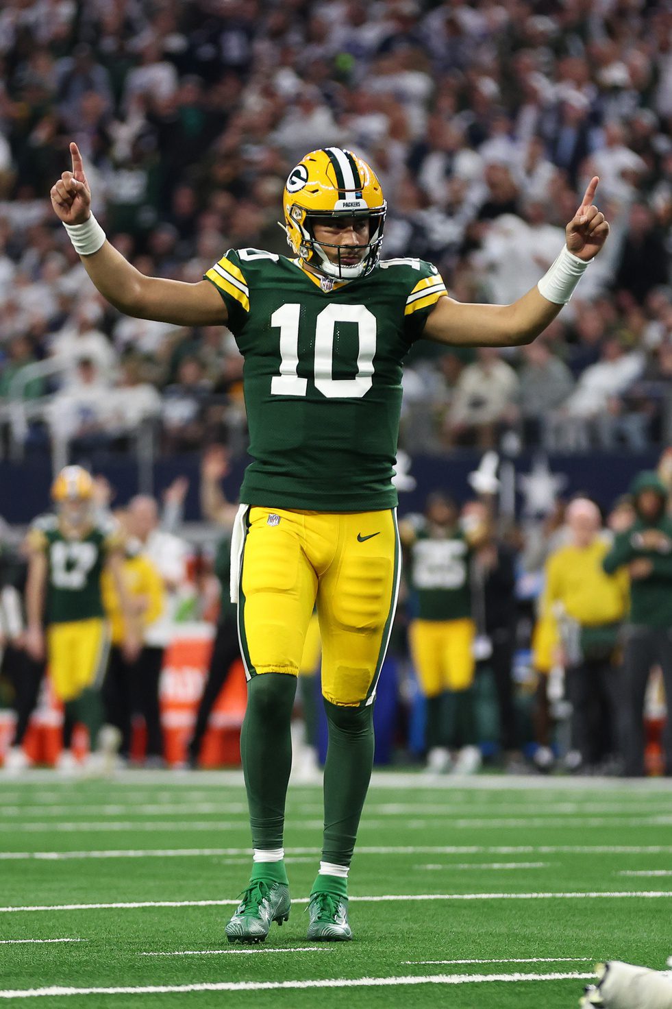 Jan 14, 2024; Arlington, Texas, USA; Green Bay Packers quarterback Jordan Love (10) reacts after a touchdown against the Dallas Cowboys in the first quarter for the 2024 NFC wild card game at AT&T Stadium. Mandatory Credit: Tim Heitman-USA TODAY Sports