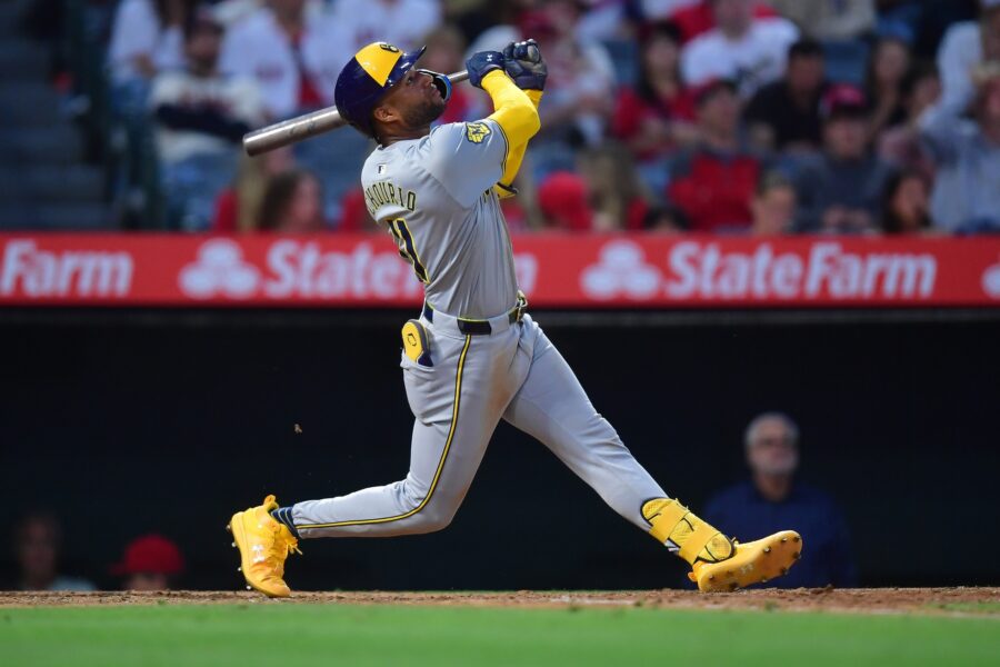 Jun 18, 2024; Anaheim, California, USA; Milwaukee Brewers outfielder Jackson Chourio (11) hits a sacrifice RBI against the Los Angeles Angels during the sixth inning at Angel Stadium. Mandatory Credit: Gary A. Vasquez-Imagn Images