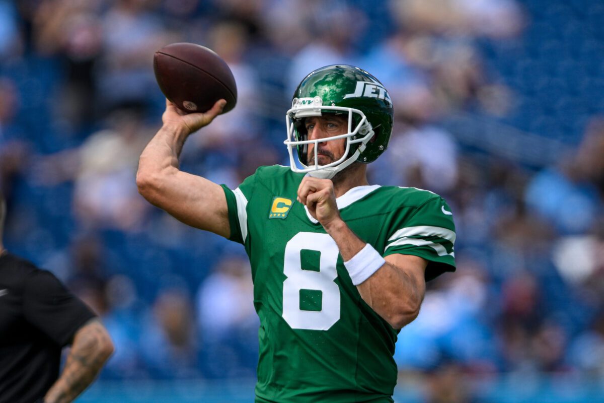 Sep 15, 2024; Nashville, Tennessee, USA; New York Jets quarterback Aaron Rodgers (8) throws during pregame warmups against the Tennessee Titans at Nissan Stadium. Mandatory Credit: Steve Roberts-Imagn Images