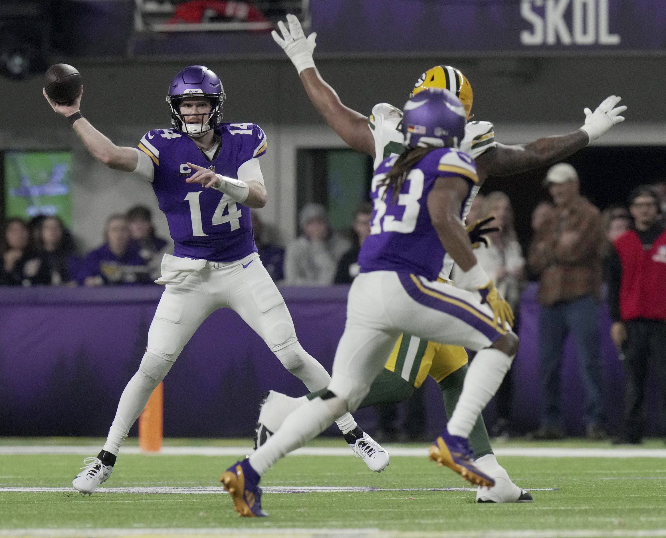 Dec 29, 2024; Minneapolis, Minnesota, USA; Minnesota Vikings quarterback Sam Darnold (14) throws a pass during the third quarter against the Green Bay Packers at U.S. Bank Stadium. Mandatory Credit: Mark Hoffman/USA TODAY NETWORK-Wisconsin via Imagn Images