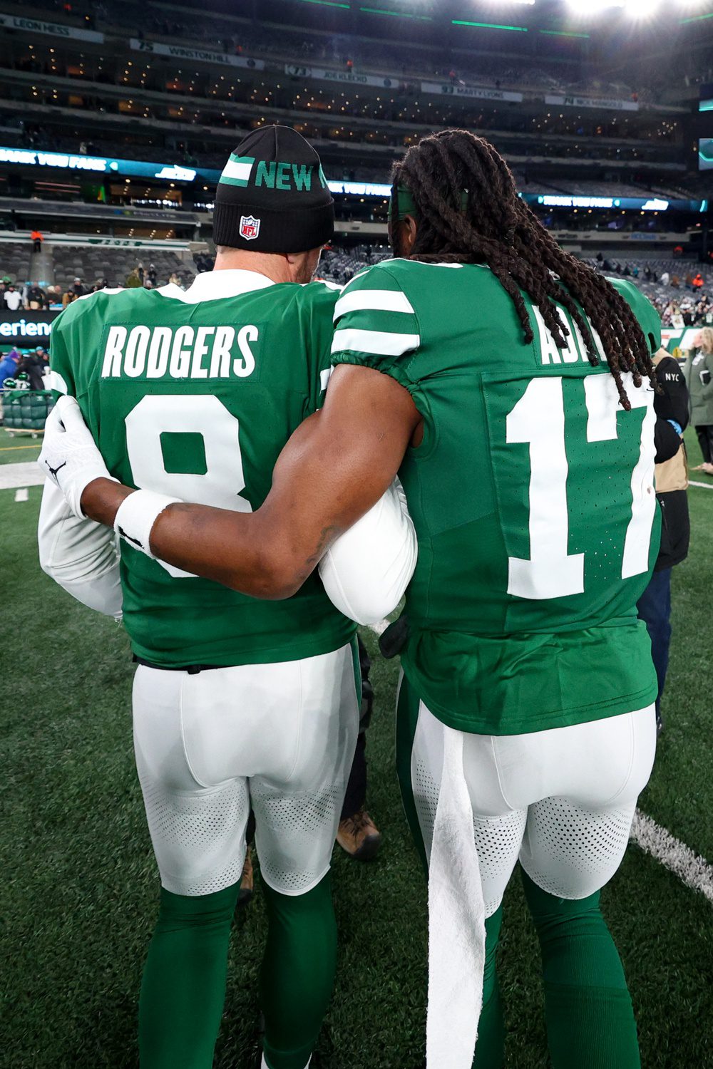 Jan 5, 2025; East Rutherford, New Jersey, USA; New York Jets quarterback Aaron Rodgers (8) and wide receiver Davante Adams (17) walk on the field after the Jets win over the Miami Dolphins at MetLife Stadium. Mandatory Credit: Ed Mulholland-Imagn Images Packers