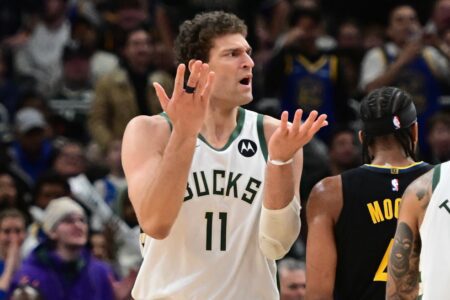 Milwaukee Bucks center Brook Lopez (11) reacts after a foul call, Garry Harris