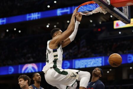 Feb 21, 2025; Washington, District of Columbia, USA; Milwaukee Bucks forward Giannis Antetokounmpo (34) dunks the ball as Washington Wizards guard Bilal Coulibaly (0) looks on in the first half at Capital One Arena. Mandatory Credit: Geoff Burke-Imagn Images