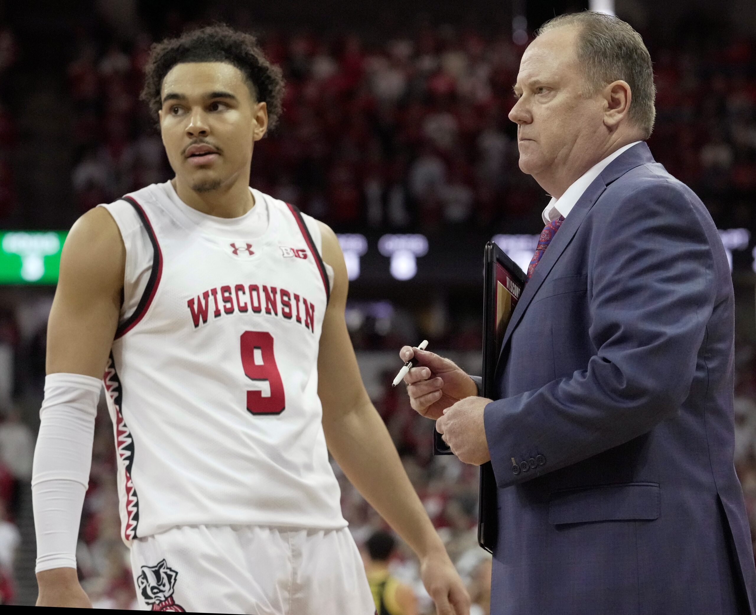 Wisconsin guard John Tonje (9) listens to head coach Greg Gard during the second half of their game Saturday, February 22, 2025 at the Kohl Center in Madison, Wisconsin. Oregon beat Wisconsin 77-73 in overtime.