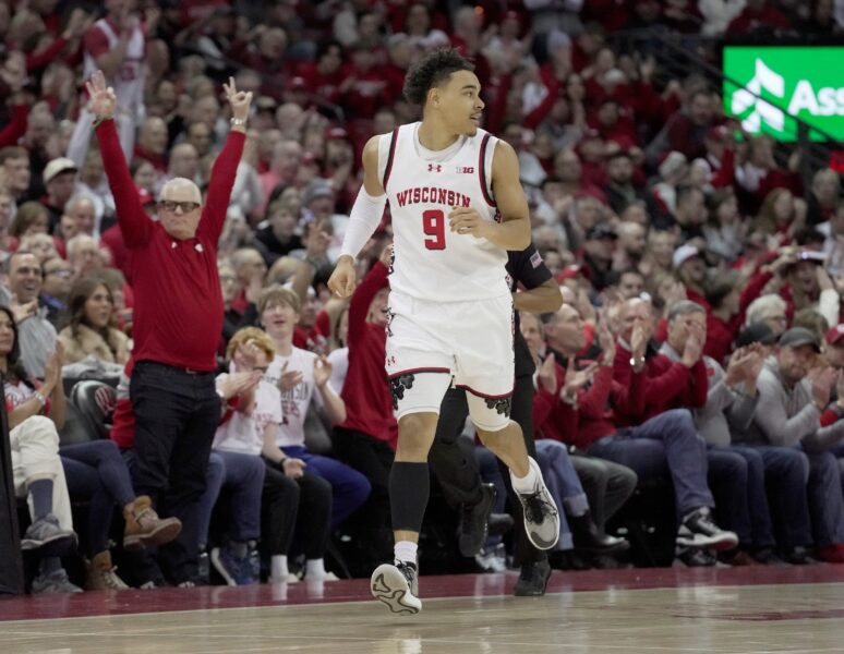 The crowd explodes after the Wisconsin John Tonje basketball guard (9) hits the three -point basket