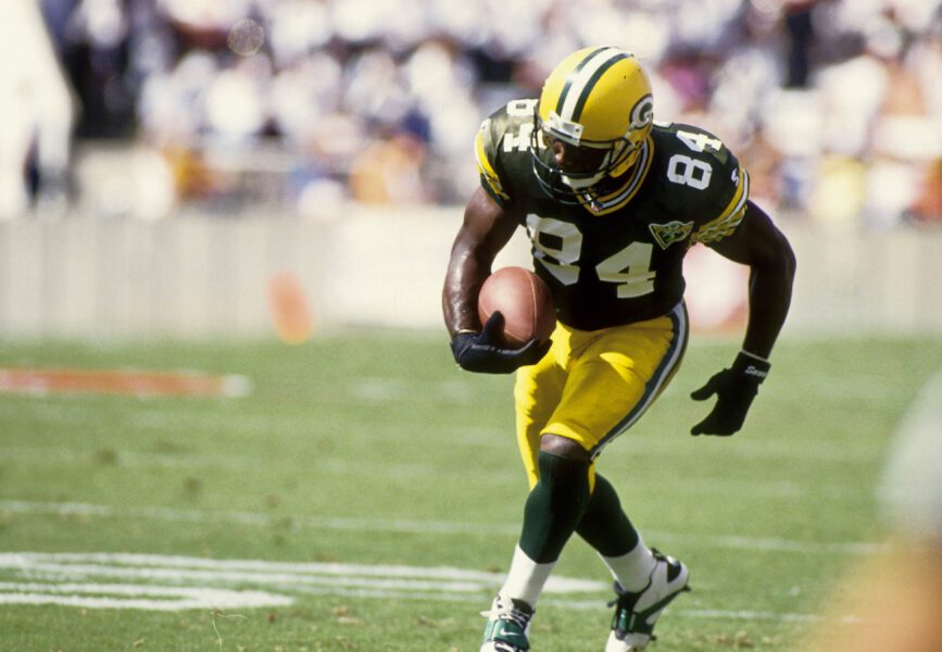 Oct 24, 1993; Tampa, FL, USA; Green Bay Packers receiver Sterling Sharpe (84) scores a touchdown against the Tampa Bay Buccaneers at Tampa Stadium. FILE PHOTO; Mandatory Credit: Imagn Images