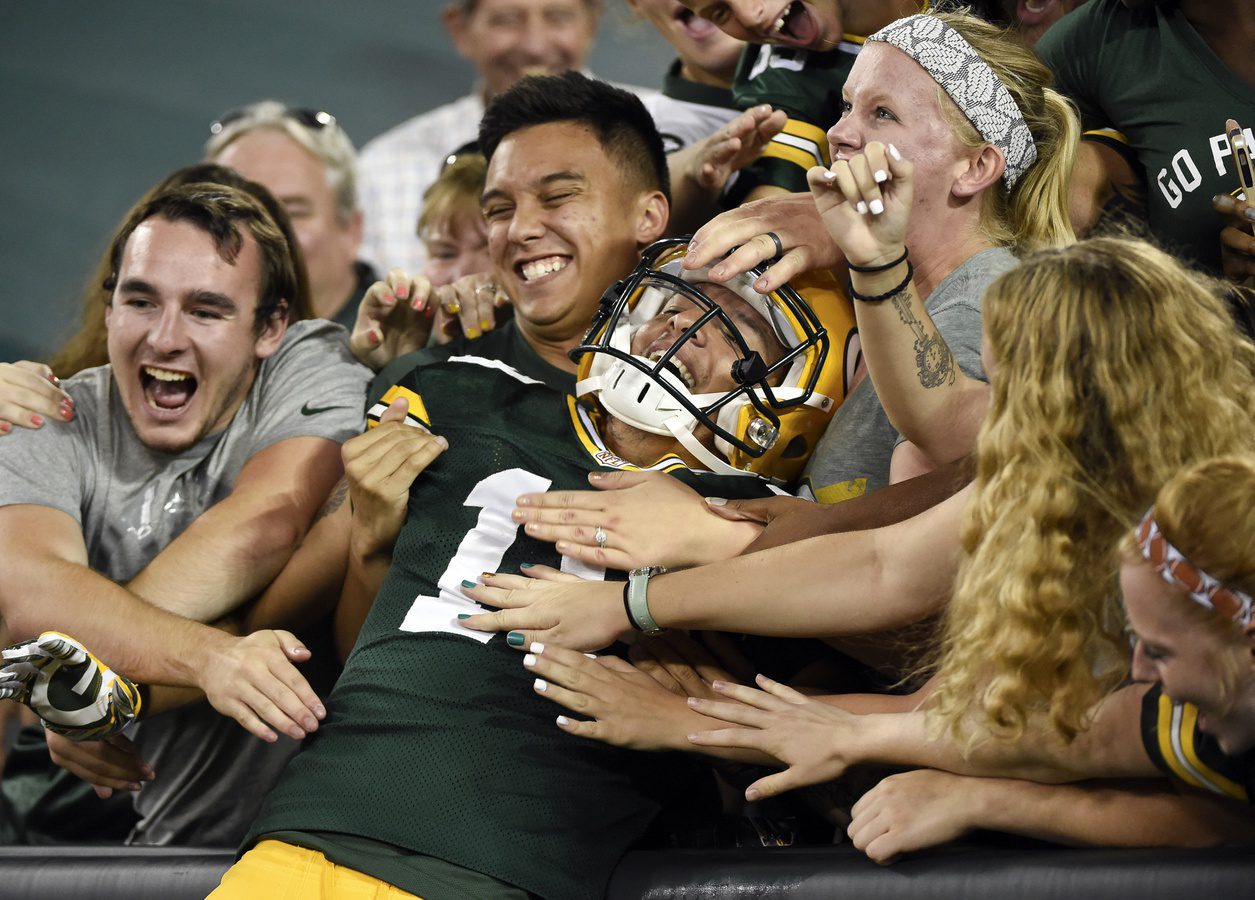 Sep 3, 2015; Green Bay, WI, USA; Green Bay Packers wide receiver Myles White (19) celebrates with fans after scoring a touchdown in the fourth quarter against the New Orleans Saints at Lambeau Field. Mandatory Credit: Benny Sieu-Imagn Images