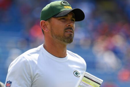 Aug 28, 2021; Orchard Park, New York, USA; Green Bay Packers head coach Matt LaFleur jogs on the field prior to the game against the Buffalo Bills at Highmark Stadium. Mandatory Credit: Rich Barnes-Imagn Images