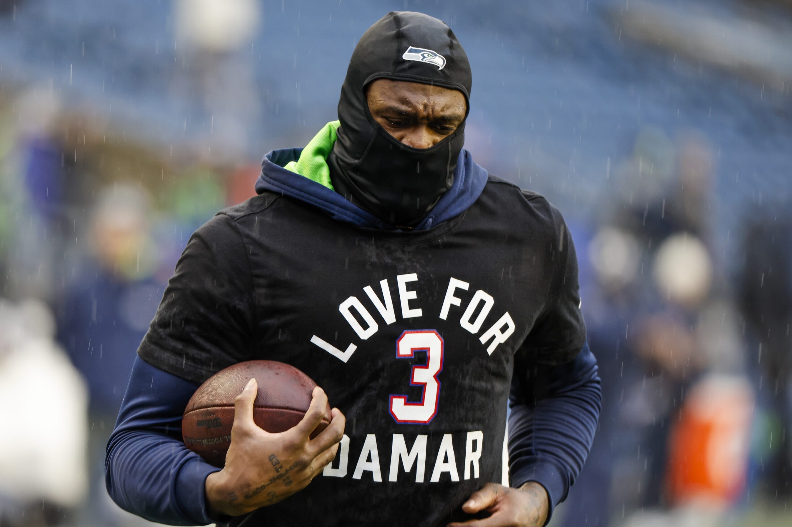 Jan 8, 2023; Seattle, Washington, USA; Seattle Seahawks wide receiver DK Metcalf (14) participates in early pregame warmups against the Los Angeles Rams while wearing a Love for Damar t-shirt in honor of Buffalo Bills safety Damar Hamlin (3, not pictured) at Lumen Field. Mandatory Credit: Joe Nicholson-Imagn Images