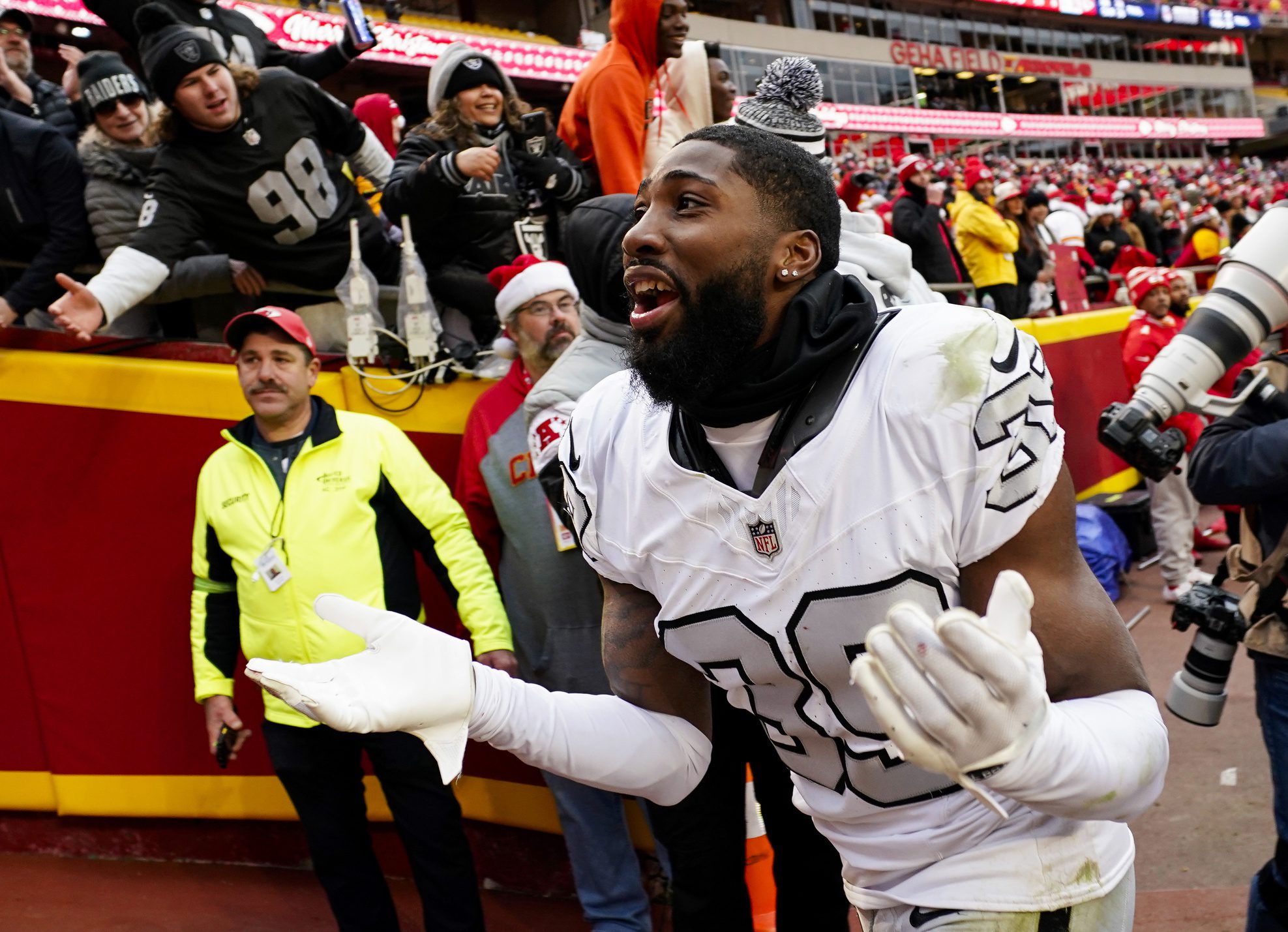 Dec 25, 2023; Kansas City, Missouri, USA; Las Vegas Raiders cornerback Nate Hobbs (39) interacts with the crowd after defeating the Kansas City Chiefs at GEHA Field at Arrowhead Stadium. Mandatory Credit: Jay Biggerstaff-Imagn ImagesPackers