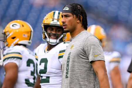 Sep 22, 2024; Nashville, Tennessee, USA; Green Bay Packers quarterback Jordan Love (10) and Green Bay Packers quarterback Malik Willis (2) look on during pregame warmups before the game against the Tennessee Titans at Nissan Stadium. Mandatory Credit: Steve Roberts-Imagn Images