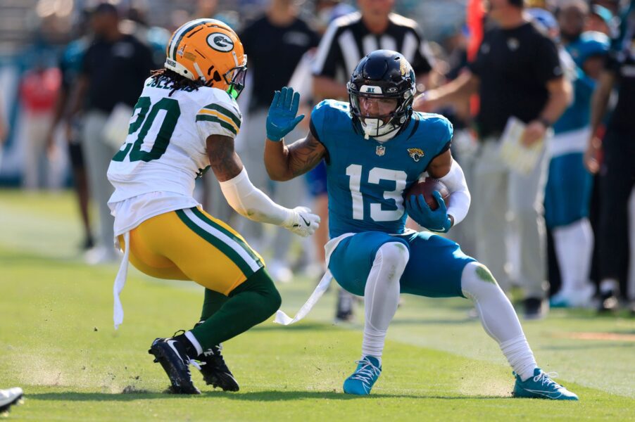 Jacksonville Jaguars wide receiver Christian Kirk (13) tries to manuver past Green Bay Packers safety Javon Bullard (20) during the third quarter of an NFL football matchup Sunday, Oct. 27, 2024 at EverBank Stadium in Jacksonville, Fla. The Packers edged the Jaguars 30-27 on a last-second field goal. [Corey Perrine/Florida Times-Union]