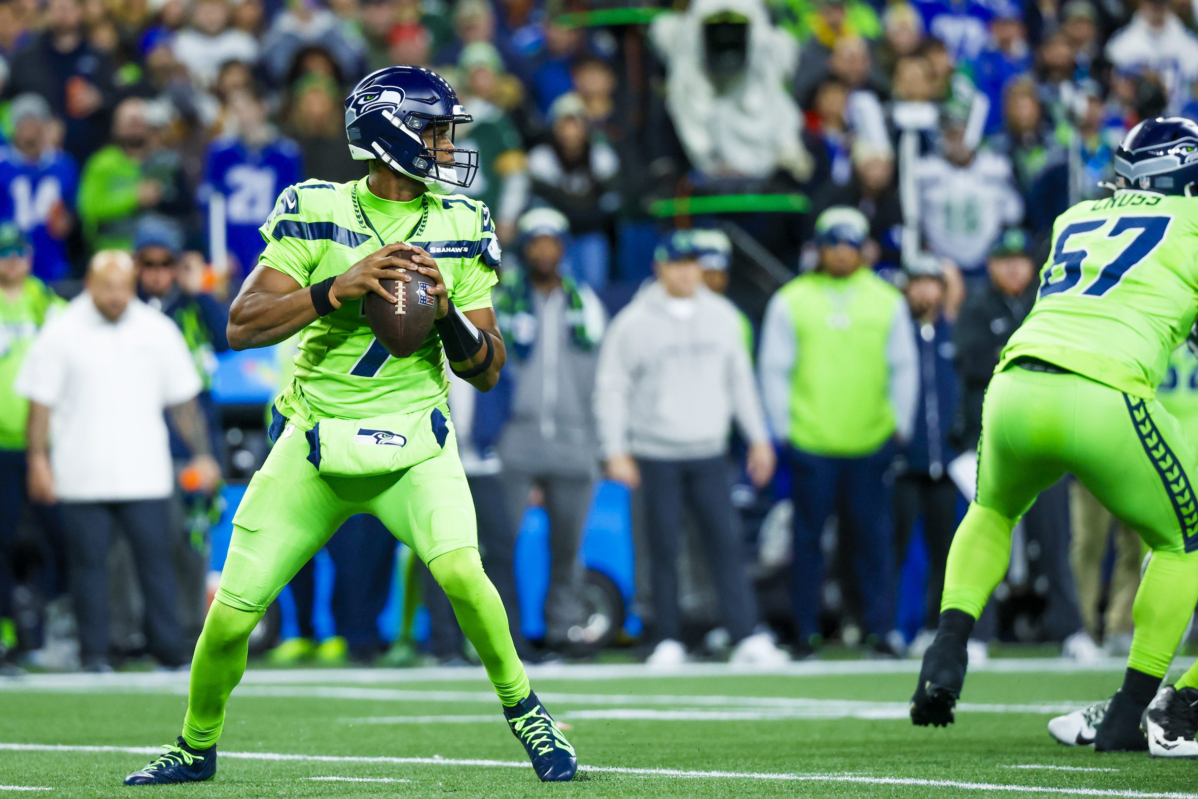 Dec 15, 2024; Seattle, Washington, USA; Seattle Seahawks quarterback Geno Smith (7) looks to pass against the Green Bay Packers during the first quarter at Lumen Field. Mandatory Credit: Joe Nicholson-Imagn Images