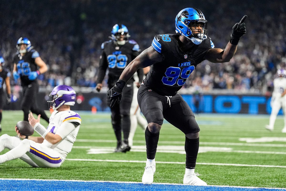 Detroit Lions defensive end Za'Darius Smith (99) celebrates a sack against Minnesota Vikings quarterback Sam Darnold (14) during the first half at Ford Field in Detroit on Sunday, Jan. 5, 2025. © Junfu Han / USA TODAY NETWORK via Imagn Images