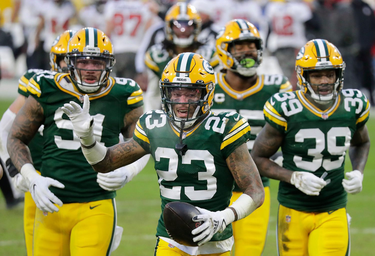 Green Bay Packers cornerback Jaire Alexander (23) celebrates a fourth quarter interception against the Tampa Bay Buccaneers during the NFC Championship game on Sunday, January 24, 2021, at Lambeau Field in Green Bay, Wis.