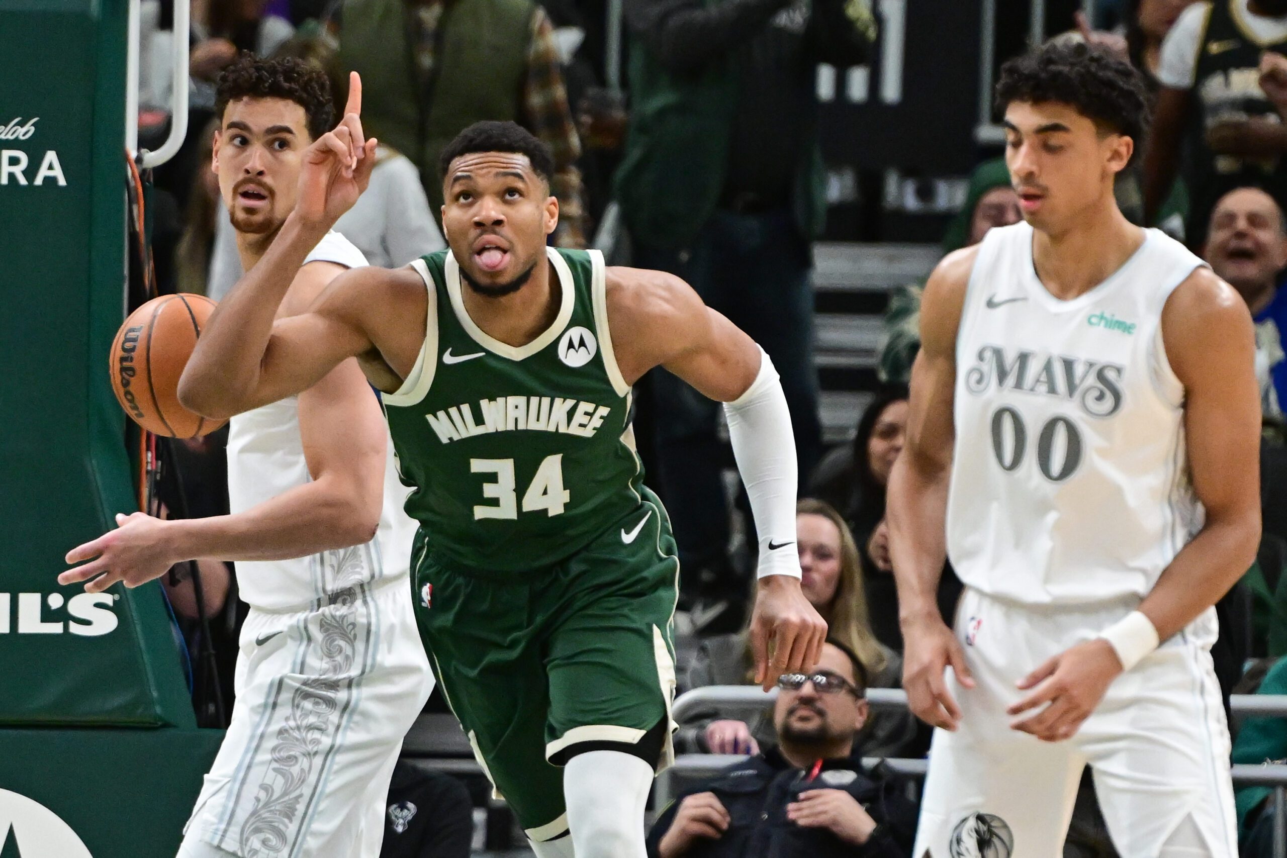 Mar 5, 2025; Milwaukee, Wisconsin, USA; Milwaukee Bucks forward Giannis Antetokounmpo (34) reacts after scoring his 20,000th career point in the third quarter against the Dallas Mavericks at Fiserv Forum. Mandatory Credit: Benny Sieu-Imagn Images