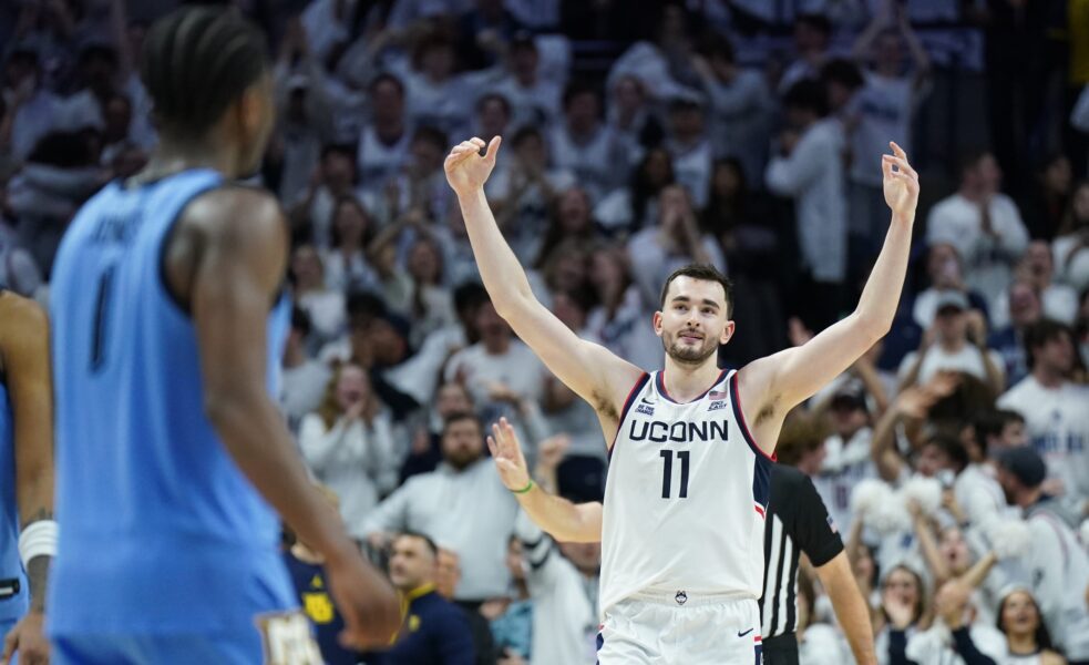 UConn Huskies forward Alex Karaban (11) reacts after his three point basket