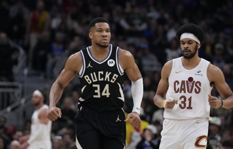 Mar 9, 2025; Milwaukee, Wisconsin, USA; Milwaukee Bucks forward Giannis Antetokounmpo (34) runs down the court after making a basket against Cleveland Cavaliers center Jarrett Allen (31) in the first half at Fiserv Forum. Mandatory Credit: Michael McLoone-Imagn Images