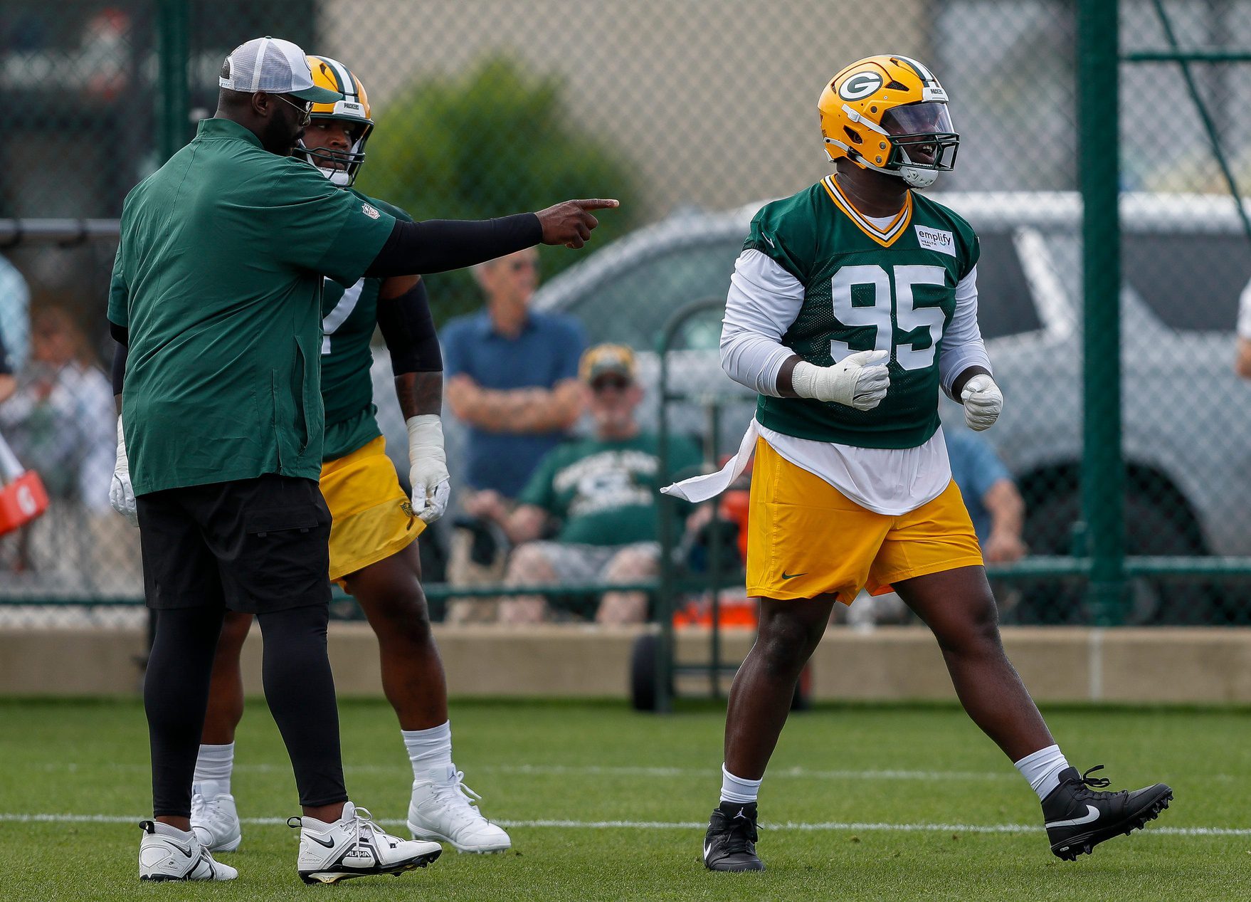Green Bay Packers defensive tackle Devonte Wyatt (95) reacts after winning a practice rep.