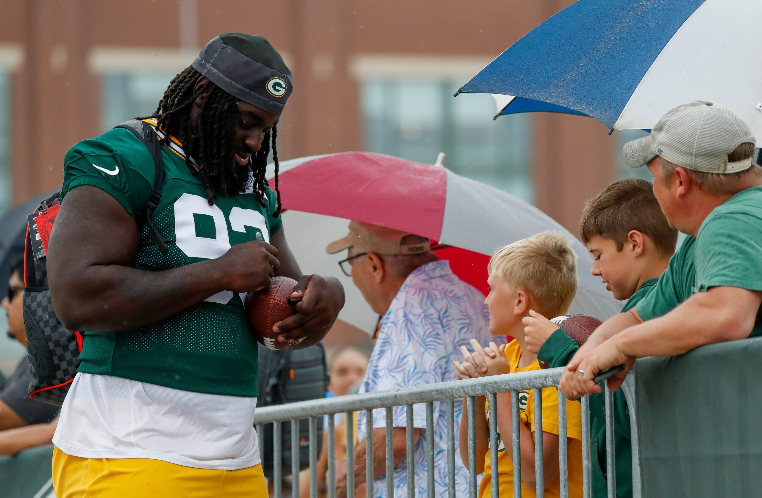 Green Bay Packers might have solved 1 issue at camp with unique player 1 Green Bay Packers defensive lineman Nazir Stackhouse (93) signs an autograph for a fan as he makes his way to practice during the first day of training camp on Wednesday