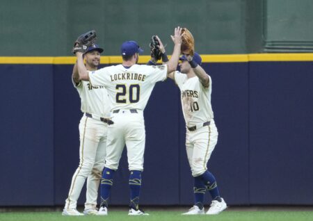 Milwaukee Brewers outfielder Blake Perkins (16), outfielder Brandon Lockridge (20) and outfielder Sal Frelick (10)