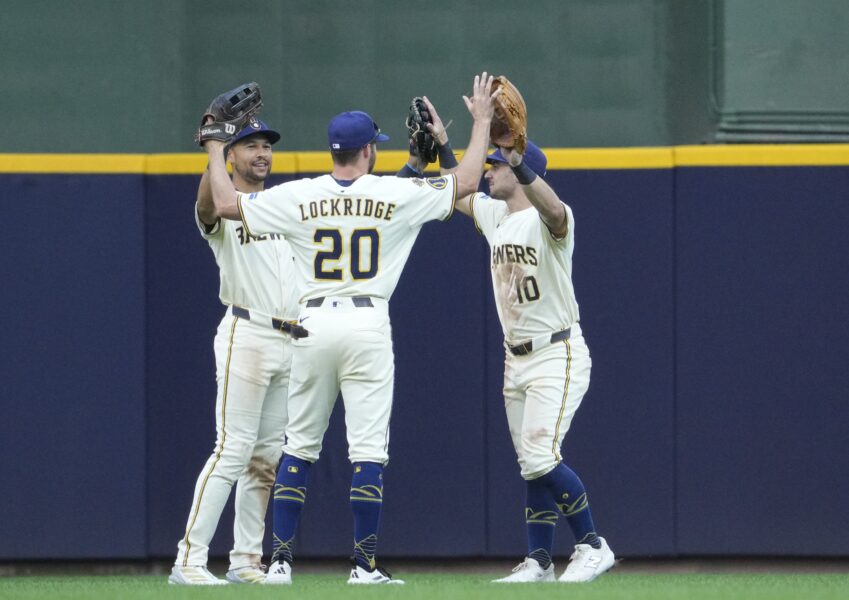 Milwaukee Brewers outfielder Blake Perkins (16), outfielder Brandon Lockridge (20) and outfielder Sal Frelick (10)