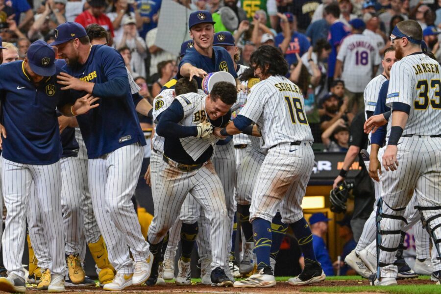 Aug 10, 2025; Milwaukee, Wisconsin, USA; Milwaukee Brewers left fielder Isaac Collins (6) celebrates with teammates after hitting a walk-off home run in the ninth inning against the New York Mets at American Family Field. Mandatory Credit: Benny Sieu-Imagn Images