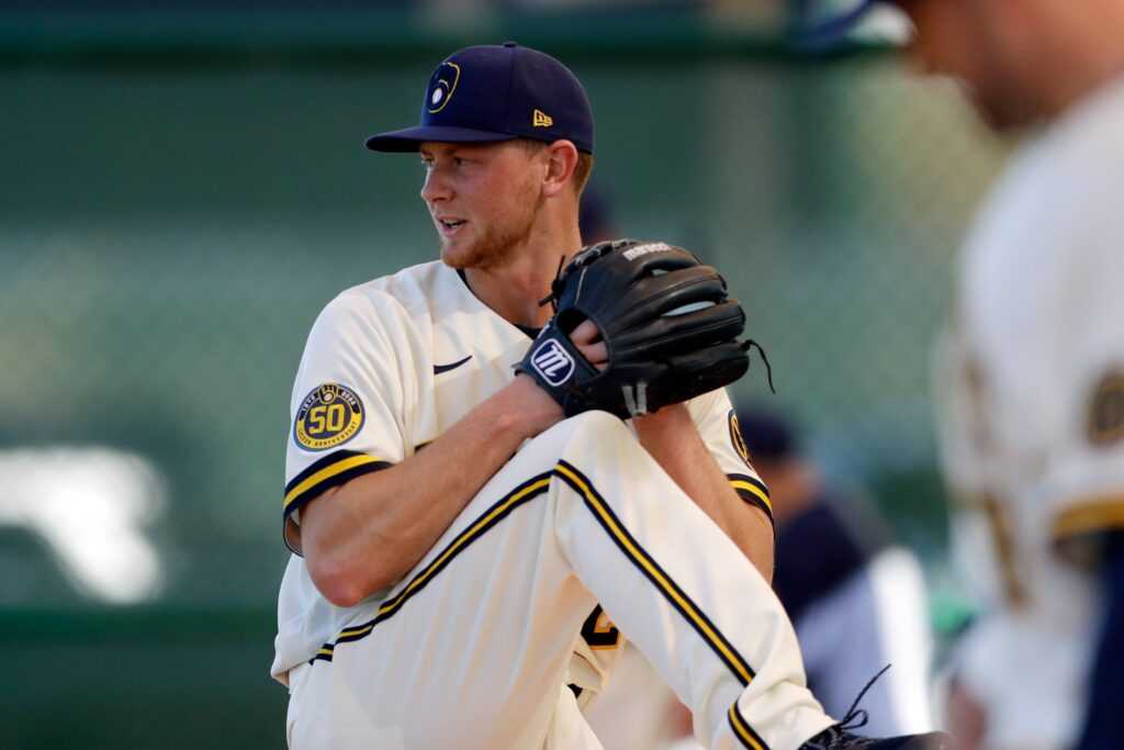 Brewers' pitcher Eric Lauer throws during the first day of spring training in 2020. (Photo by Gregory Bull/AP)