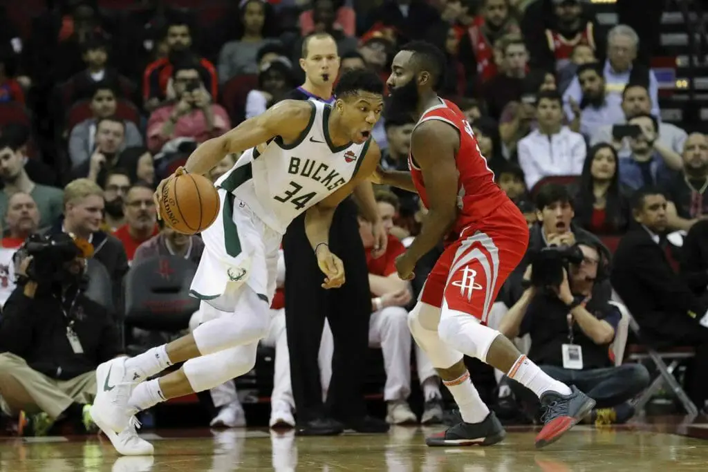HOUSTON, TX - DECEMBER 16: Giannis Antetokounmpo #34 of the Milwaukee Bucks drives to the basket defended by James Harden #13 of the Houston Rockets in the first half at Toyota Center on December 16, 2017 in Houston, Texas. NOTE TO USER: User expressly acknowledges and agrees that, by downloading and or using this photograph, User is consenting to the terms and conditions of the Getty Images License Agreement. (Photo by Tim Warner/Getty Images) (NBA Rumors)