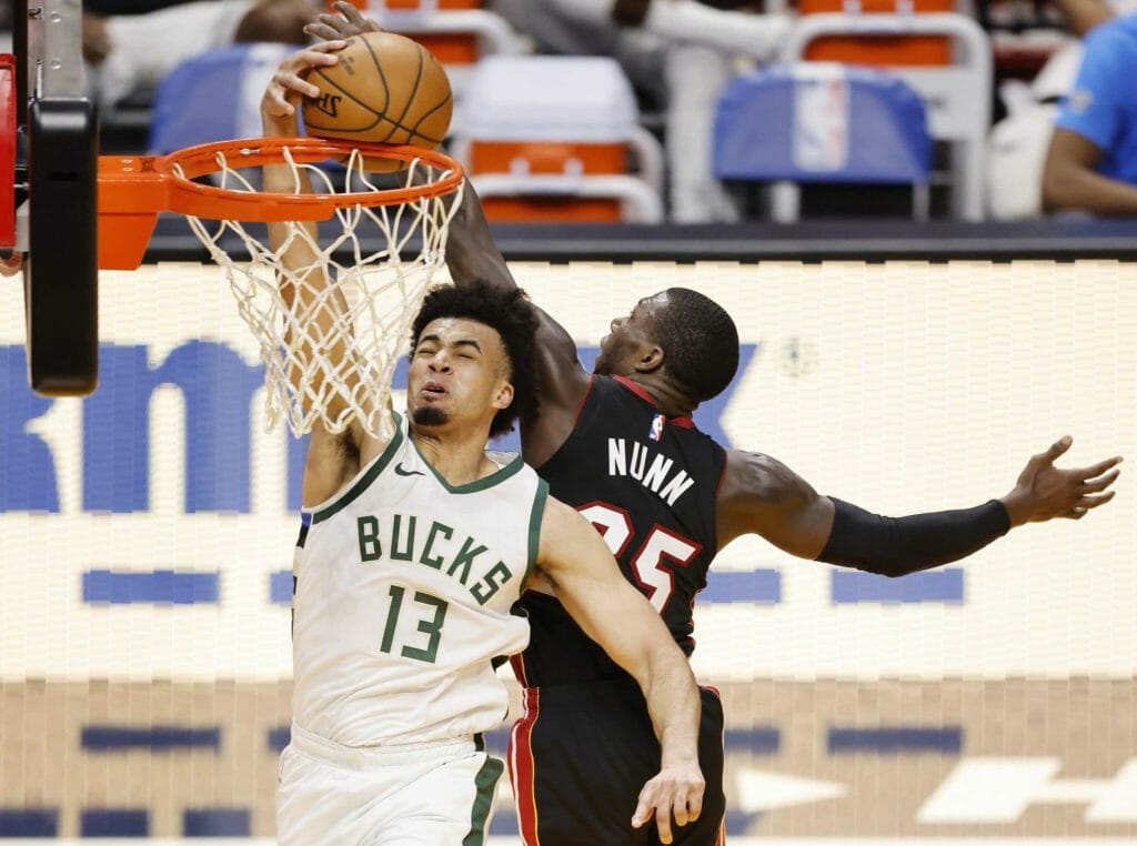 MIAMI, FLORIDA - DECEMBER 29: Kendrick Nunn #25 of the Miami Heat blocks a dunk by Jordan Nwora #13 of the Milwaukee Bucks during the fourth quarter at American Airlines Arena on December 29, 2020 in Miami, Florida. (Photo by Michael Reaves/Getty Images) NBA Rumors