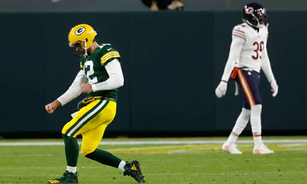 Rodgers celebrates as he often does against the Bears