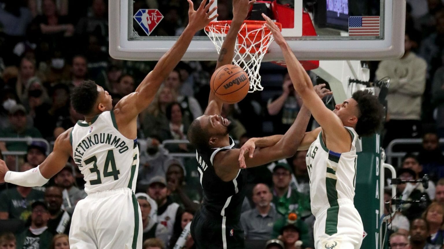 Giannis Antetokounmpo and Jordan Nwora challenge Kevin Durant at the rim (Image Credit: Milwaukee Journal Sentinel). NBA Rumors