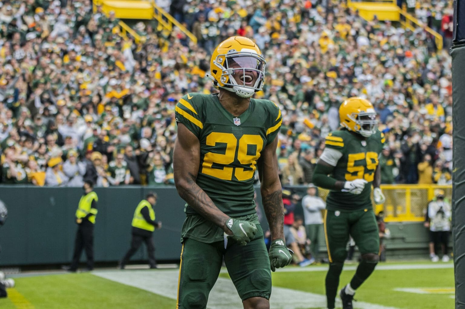 Rasul Douglas and De'Vondre Campbell of the Green Bay Packers during a game at Lambeau Field.