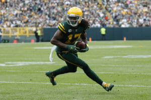 Davante Adams of the Green Bay Packers catches and runs with the football at Lambeau Field.