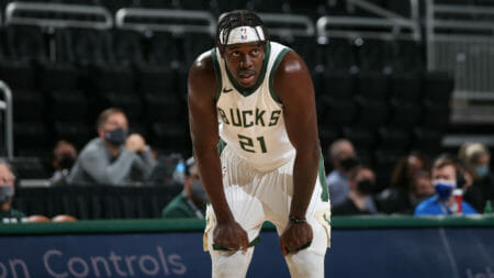 MILWAUKEE, WI - DECEMBER 14: Jrue Holiday #11 of the Milwaukee Bucks looks on during the game against the Dallas Mavericks during a preseason game on December 14, 2020 at the Fiserv Forum Center in Milwaukee, Wisconsin. NOTE TO USER: User expressly acknowledges and agrees that, by downloading and or using this Photograph, user is consenting to the terms and conditions of the Getty Images License Agreement. Mandatory Copyright Notice: Copyright 2020 NBAE (Photo by Gary Dineen/NBAE via Getty Images).