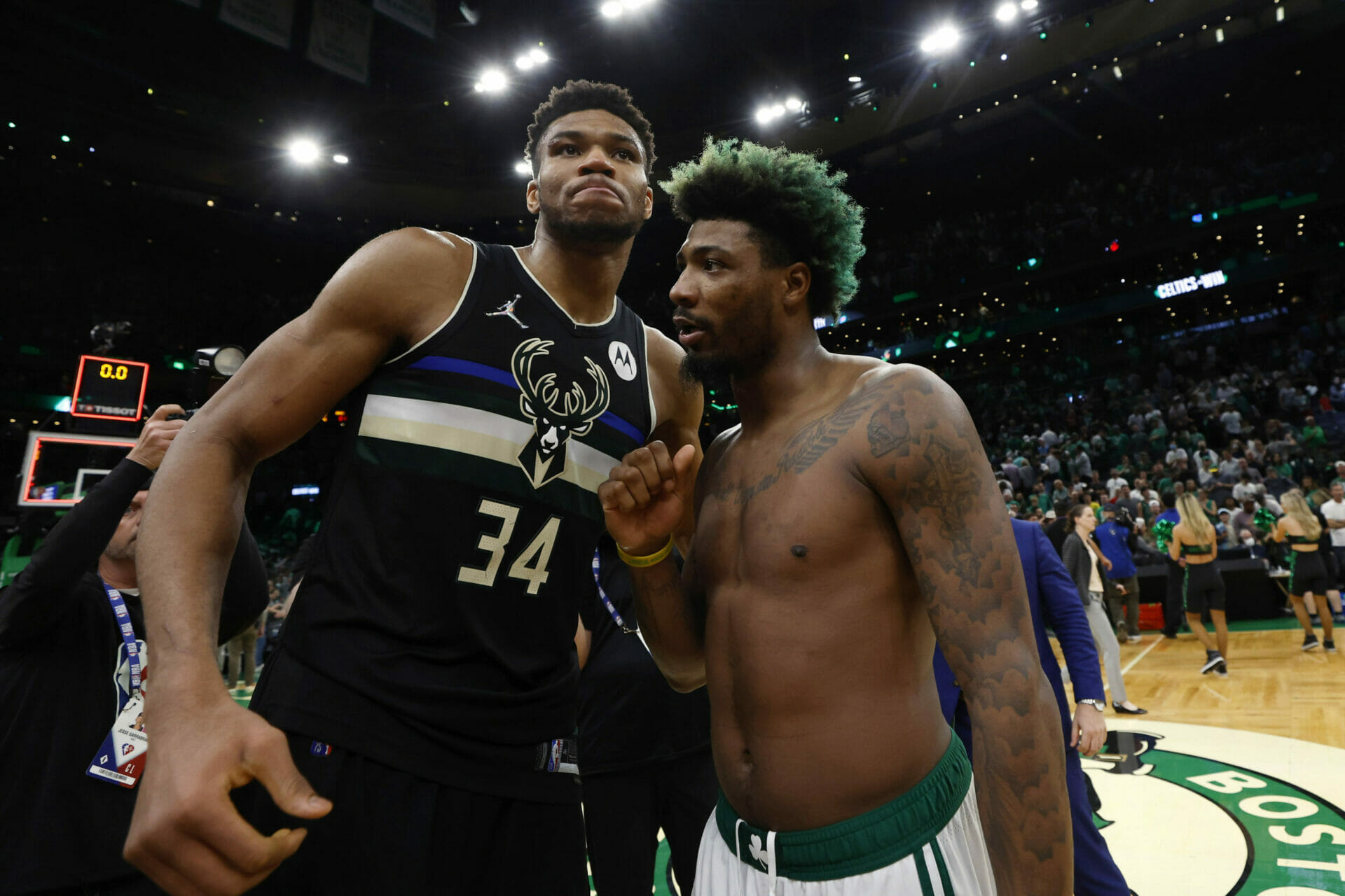 May 15, 2022; Boston, Massachusetts, USA; Milwaukee Bucks forward Giannis Antetokounmpo (34) congratulates Boston Celtics guard Marcus Smart (36) after the Celtics win in game seven of the second round of the 2022 NBA playoffs at TD Garden. Mandatory Credit: Winslow Townson-USA TODAY Sports (NBA News)