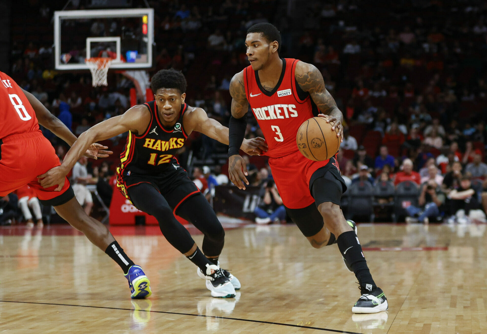 Apr 10, 2022; Houston, Texas, USA; Houston Rockets guard Kevin Porter Jr. (3) drives with the ball as Atlanta Hawks forward De'Andre Hunter (12) defends during the first quarter at Toyota Center. Mandatory Credit: Troy Taormina-USA TODAY Sports (NBA Rumors)