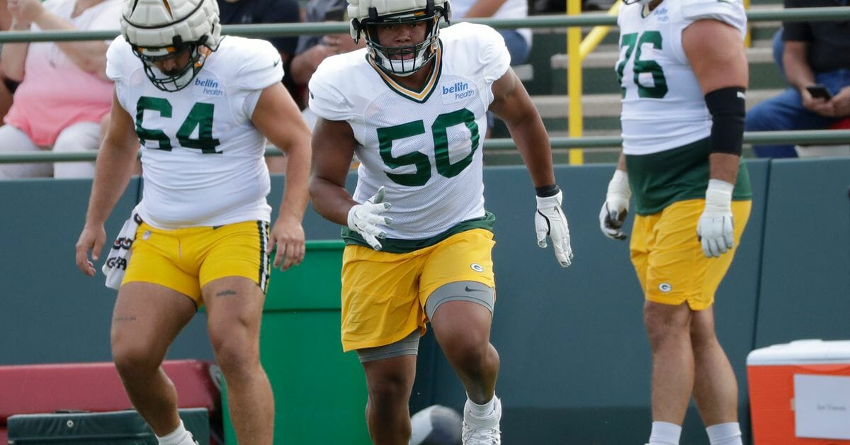 Zach Tom performs drills with the Green Bay Packers